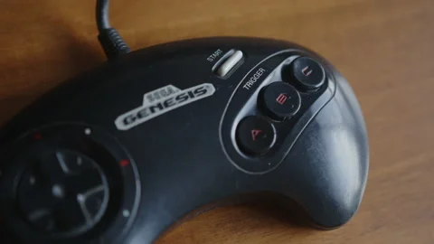 Rack Focus Close Up of a Sega Genesis Video Game Controller Stock Footage 161007853