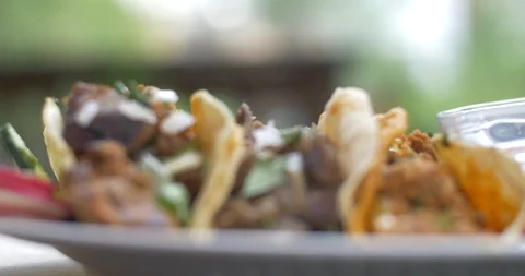 Rack Focus Close Up on Street Taco Dinner with Onion Lime and Cilantro Stock Footage 113661640