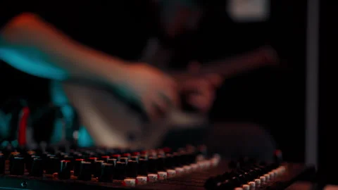 Rack focus close up view bearded guy in a cap plays an electric guitar at a rock Stock Footage 270926358