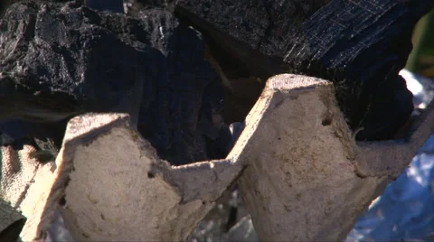 Rack focus coals burning in brazier bbq Stock-Footage 63210377