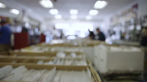 Rack focus comic book boxes store slow motion 4K Stock Footage 171974103