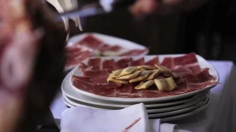 Rack focus cutting spanish ham Video stock 44081290