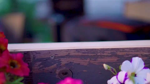 Rack focus from the edge of the window to the outside table slow motion HD Stock-Footage 204822816
