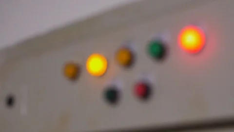 Rack focus of electric control box with indicator light in a factory Stock Footage 112671980
