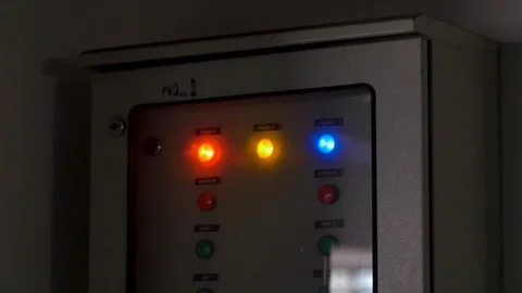 Rack focus of electric control box with indicator light in a factory Stock Footage 112671998