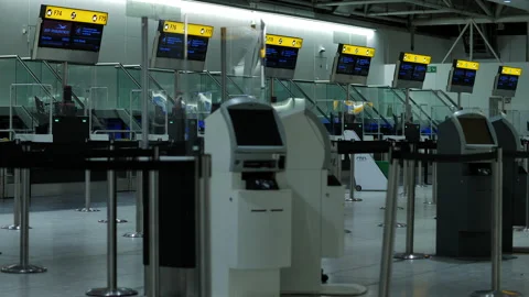 Rack focus empty Heathrow airport kiosks in the middle of night 4K Stock Footage 229140953