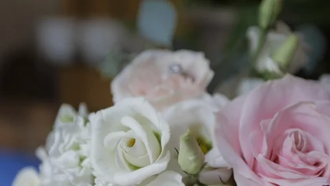 Rack focus to engagement ring in bouquet Stock Footage 97094780