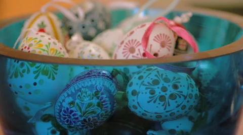 Rack Focus of European Easter Eggs in a Blue Glass Bowl Stock Footage 62747676