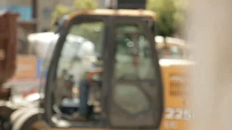 Rack Focus to Excavator and Operator Stock Footage 100074726