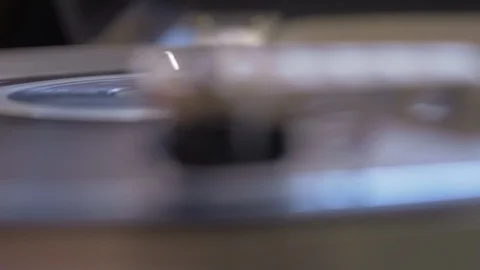 Rack focus extreme close up of needle playing vinyl record Stock Footage 88762852