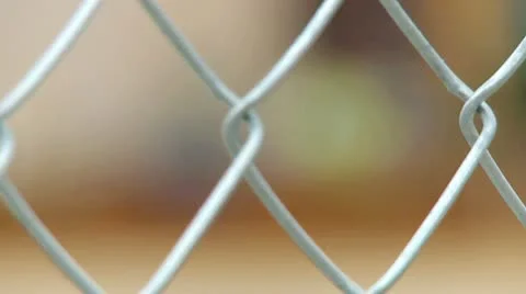 RACK FOCUS FENCE TO CONSTRUCTION WORKERS Stock Footage 14827567