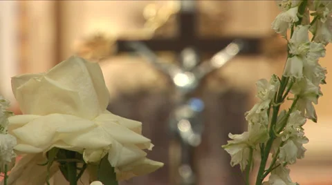 Rack focus from flowers to cross Stock Footage 36737956