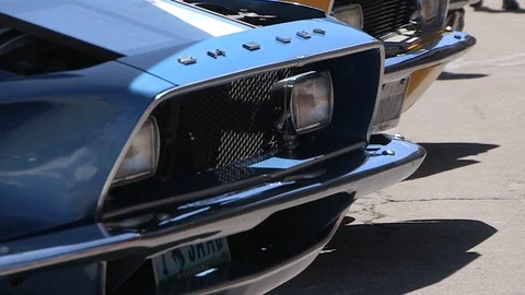 Rack focus of Ford Shelby chrome logo on car. Stock Footage 99600095