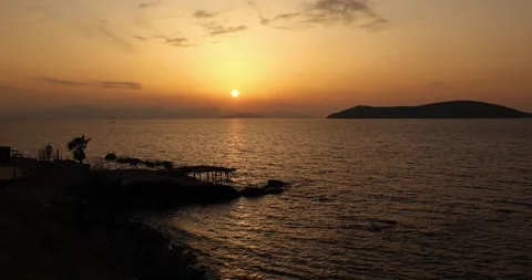 Rack Focus Golden Sunset Over Sea Pier and Island Silhouettes in Bodrum 4K 動画素材 344056947