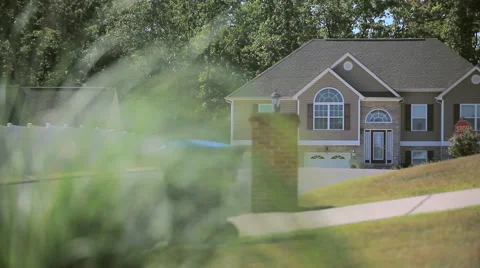 Rack Focus of Grass and House in Background Stock Footage 55415622