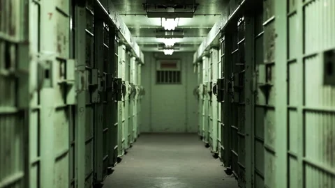 Rack focus of green prison corridor Stock Footage 191353611