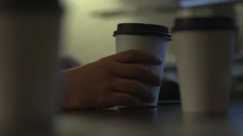 Rack Focus Hand Grabbing Coffee Cup Late Night Desk Work Vidéo 335715252