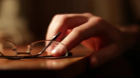 Rack focus of a hand picking up glasses Stock Footage 49395267