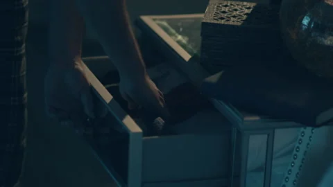 Rack focus of a home owner placing a hammer in a junk drawer, USA - Reenactment 動画素材 237696040