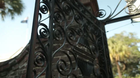 Rack focus from iron gates and state flags-Charleston Stock Footage 60925613