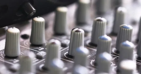 Rack Focus On Knobs Of An Analog Sound Mixer In Studio. close up 動画素材 202057789