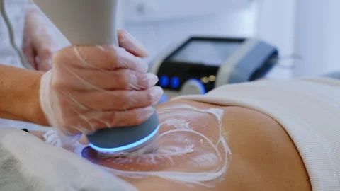 Rack Focus: Machine with Display to Masseur in Rubber Gloves Video stock 306274427