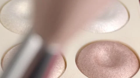 Rack Focus From Makeup Brush to Shimmer Eyeshadow Palette in Extreme Closeup Stock Footage 340805553