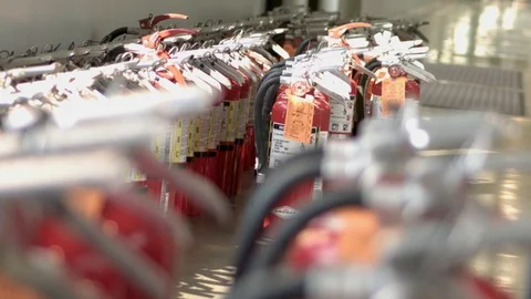 Rack Focus of Many Fire Extinguishers in School Hallway Stock-Footage 101671223