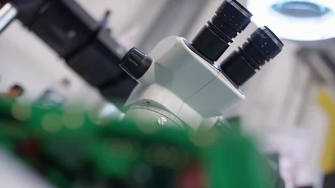 Rack focus from microscope to microchip Stock Footage 89514132