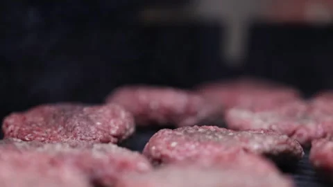 Rack Focus Moving Over Hamburger Patties Cooking On Hot Grill Slow Motion Stock-Footage 267436526
