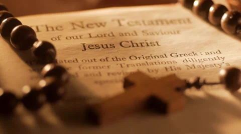 Rack focus to New Testament of the Bible Stock Footage 35062718