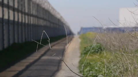 Rack focus no man's land fence US side of border Otay Mesa, near Tijuana, Mexico Stock-Footage 48406206