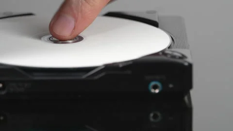 Rack focus on opening door of portable cd player Stock Footage 334673677