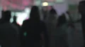 Rack focus people dancing in nightclub, enjoying nightlife HD Footage