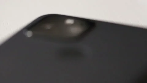 Rack focus on phone camera and fingerprint reader Stock Footage 228691190