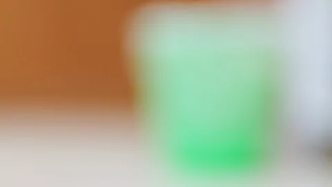 Rack focus of plastic trash can with plastic bag Video stock 124649876