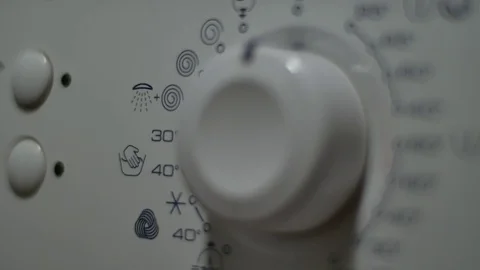 Rack Focus On The Programing Button Of A Washing Machine, Household Appliance Video stock 70165115