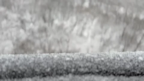 Rack focus from railing to snowy forest below Video stock 167281903