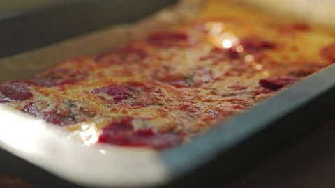 Rack Focus Reveals Entire Pepperoni Pizza in Warm Evening Sunlight Glow Stock Footage 339766600