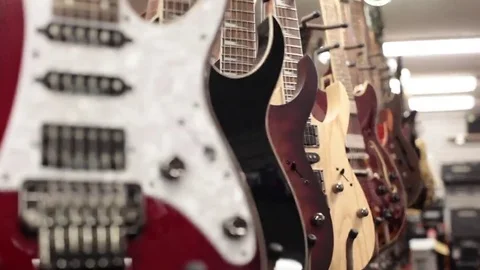 Rack focus row of guitars close up Stock Footage 69111277