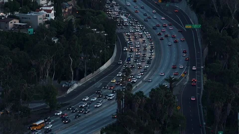 Rack focus on rush hour traffic on the Hollywood Freeway at twilight. Stock Footage 128838035