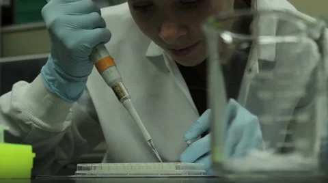 Rack Focus From Scientist To Waste Container Video stock 58226281