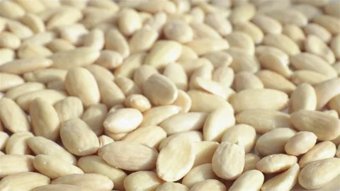 Rack focus on shelled almonds 動画素材 77406616