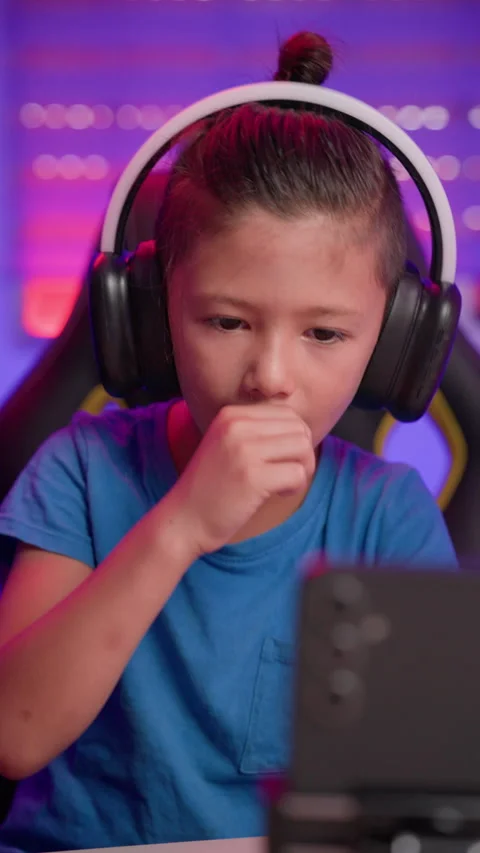 Rack Focus Shifts From Young Content Creator to Phone in Home Studio Stock Footage 345963142
