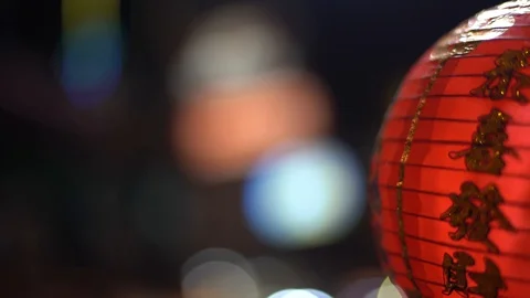 Rack Focus shot between a lantern and a sign in Chinatown in Bangkok Stock Footage