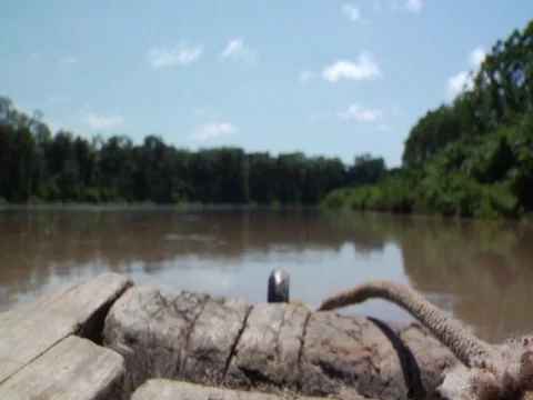 Rack Focus Shot of Boat on River in Amazon Jungle Rainforest Stock Footage 112944069
