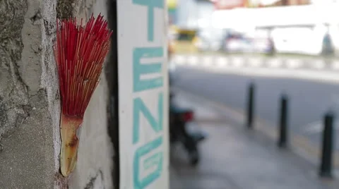 Rack Focus Shot from Chinese Incense to Pedestrians Stock Footage 48138959