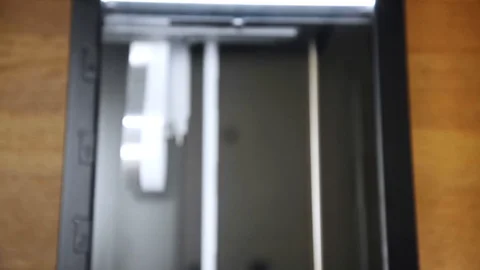 Rack focus shot of a flatbed scanner at work. Stock Footage 113571926