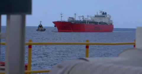 Rack Focus Shot of Geogas LPG Tanker and Tugboat in Open Water Stock Footage 346138424