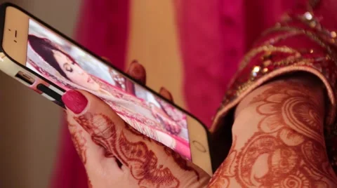 Rack Focus Shot Of A Indian Bride Using A Mobile Phone Stock Footage 49251625